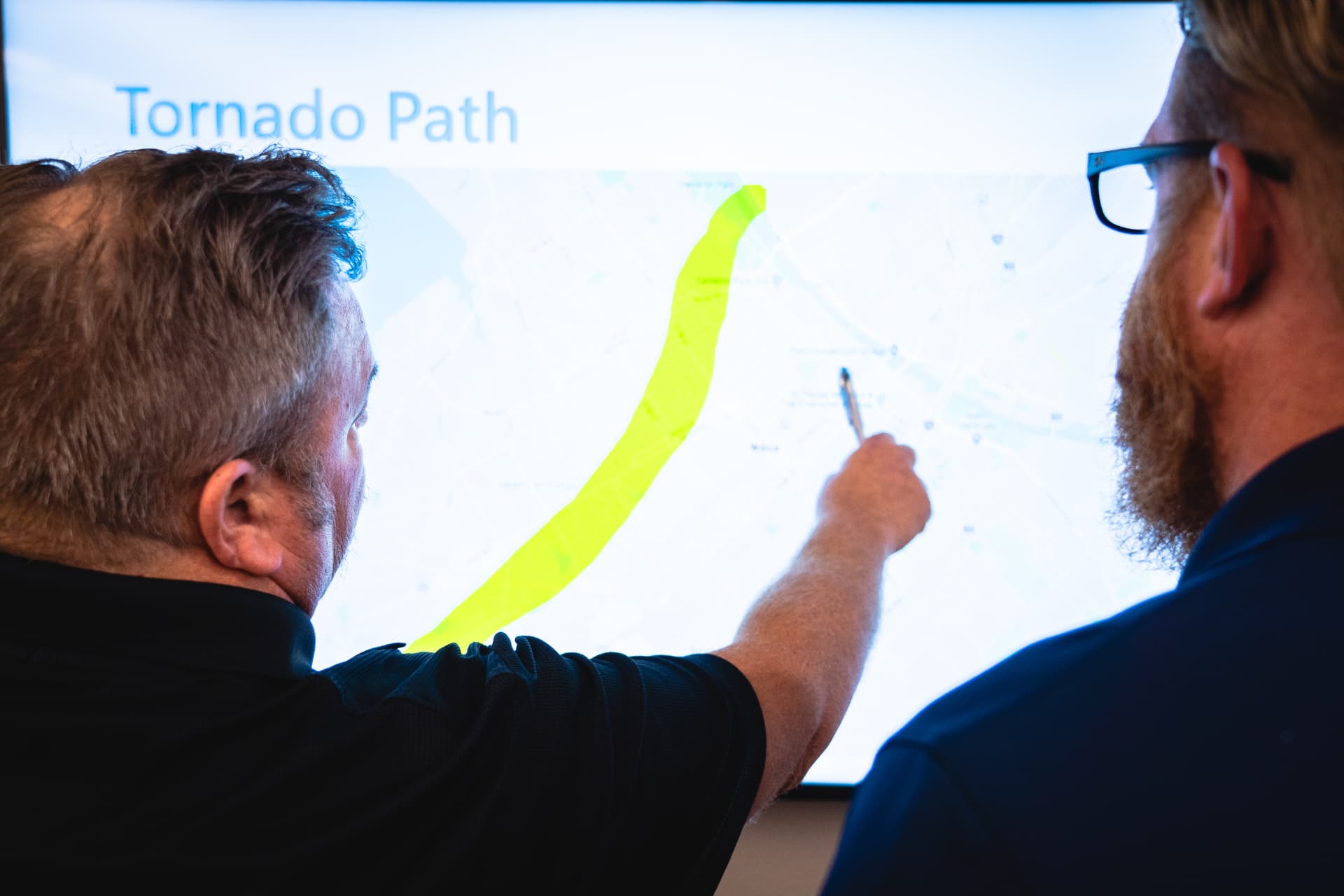 Emergency operations center staff working through an exercise scenario